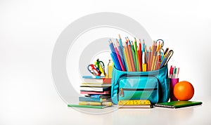 Back to school background with books and apple over blackboard. School bag and stuff on cork blackboard background with