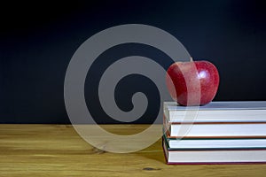 Back to school background with books over desk