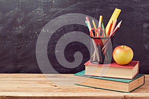 Back to school background with books, pencils and apple