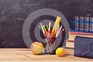 Back to school background with books, pencils and apple