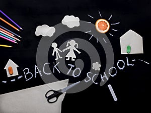 Back to school background with the child going to school. Children`s creativity. Application on a blackboard. View from above