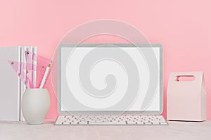 Back to school background for girl`s - white stationery, blank laptop computer and lunch box on soft pink wall and white wood desk