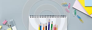 Back to School background with place for text. Horizontal banner for web design. Collection of school supplies in a bright flat