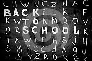 Back to school background with title `Back to school` among other letters of English alphabet