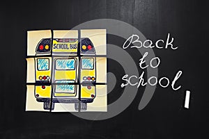 Back to school background with title `Back to school` and `school bus` written on the yellow pieces of paper