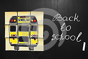 Back to school background with title `Back to school` and `school bus` written on the yellow pieces of paper