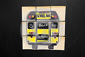 Back to school background with title `Back to school` and `school bus` written on the yellow pieces of paper photo