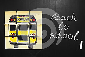 Back to school background with title `Back to school` and `school bus` written on the yellow pieces of paper photo