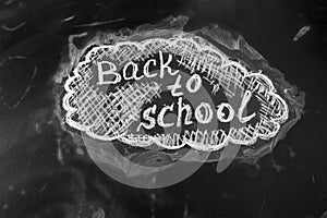Back to school background with title Back to school written by white chalk on the chalkboard