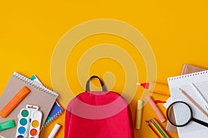 Back to school, backpack with school supplies and stationery, textbooks and notebooks. Flat lay