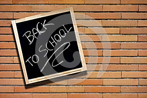 Back to School Blackboard on Brick Wall