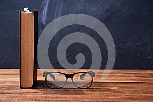 Back to school, college or student and education concept. Books and glasses