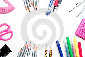 Back to school. Colorful school stationery framing isolated on white background - copyspace top view