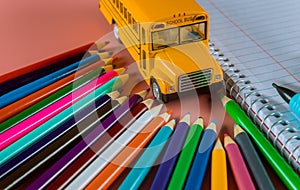 Back to school concept with bus and notebook ,pencil