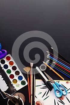 Back to school concept, colorful pencils paints brushes scissors