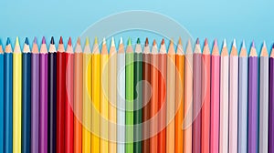 Back to school concept, colorful pencils in a row isolated blue background with copy space, teacher\'s day promotion banner