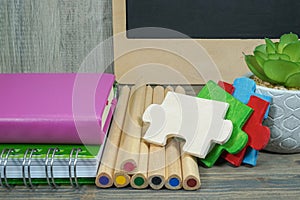 Back to school concept with colorful wooden puzzle