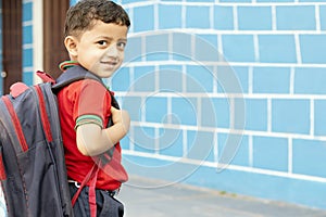 Back to school concept - Cute asian child boy with backpack going to school with fun