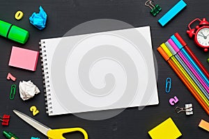 Back to school concept with notepad copy space and stationery