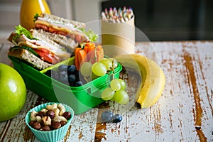 Back to school concept - packed school lunch on kitchen background