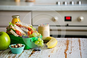 Back to school concept - packed school lunch on kitchen background