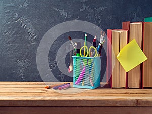 Back to school concept with pencils and old books