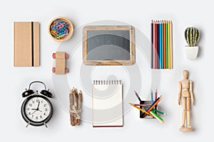 Back to school concept with school supplies organized on white background.