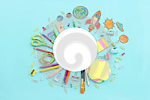 Back to school concept. Top view image of student stationery over pastel blue background