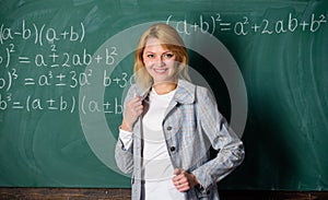 Back to school concept. Woman smiling educator classroom chalkboard background. Working conditions which prospective