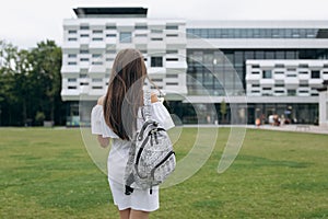 Back to school. Cute teenage girl with backpack running and going to school with fun. Happy woman student,Education