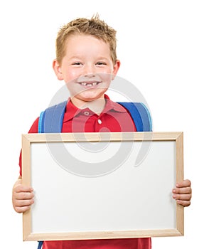 Back to school education concept with child wearing backpack and holding sign