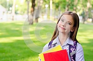 Back to school. Education concept. Cute smiling schoolgirl outdoor. Happy little girl child with backpack