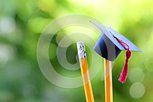 Back to school or education concept. graduation hat on pencils