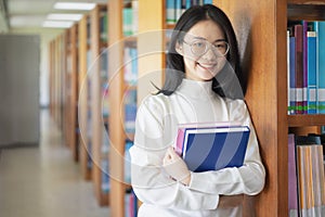 Back to school education knowledge college university concept, Beautiful female college student holding her books smiling happily