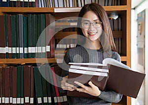 Back to school education knowledge college university concept, Beautiful female college student holding her books smiling happily