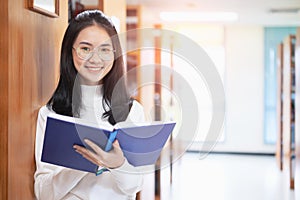 Back to school education knowledge college university concept, Beautiful female college student holding her books smiling happily