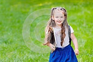 Back to school and happy times.Girl with backpack and drawing board.