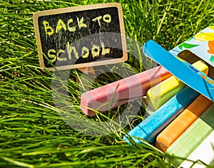 Back to school, the inscription on the mini-Board, the layout of the Board and chalk on the green grass, the concept of