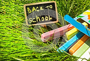 Back to school, the inscription on the mini-Board, the layout of the Board and chalk on the green grass, the concept of