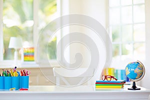 Back to school. Kids desk with books, globe