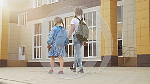 back to school. kids a walk to school for lesson. education training support concept. child walk to school with a