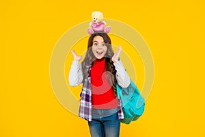 back to school. knowledge day. concept of education. kid in casual clothes on yellow background