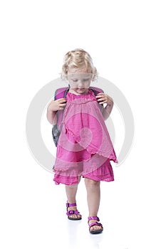 Back to school, little girl with backpack, on white