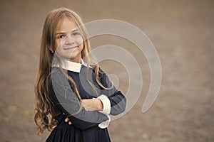 Back to school and looking cool. Happy kid back to school. Small girl wear school uniform. Dress code. Formal education