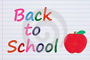 Back to School message with an apple on vintage ruled line notebook paper