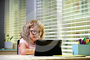 Back to school. Online remote learning. School kids with computer having video conference chat with teacher and class