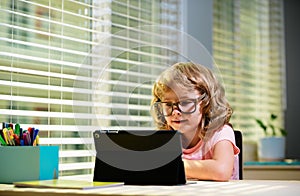 Back to school. Online remote learning. School kids with computer having video conference chat with teacher and class