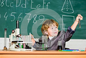 Back to school. Pupil looking through microscope . student do science experiment with microscope in lab. small boy using