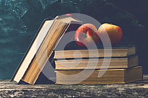 Stack of Books with chalk board as background