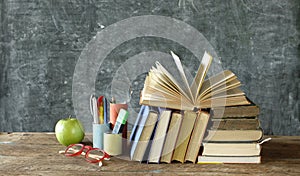 Back to school  reopening schools after corona lockdown  school supplies books  blackboard with free copy space  conceptual photo